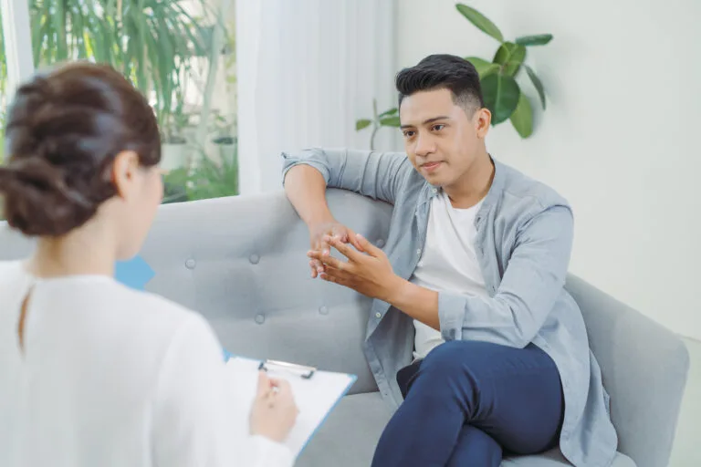 Famale psychiatrist listening to her patient who experienced traumatic events